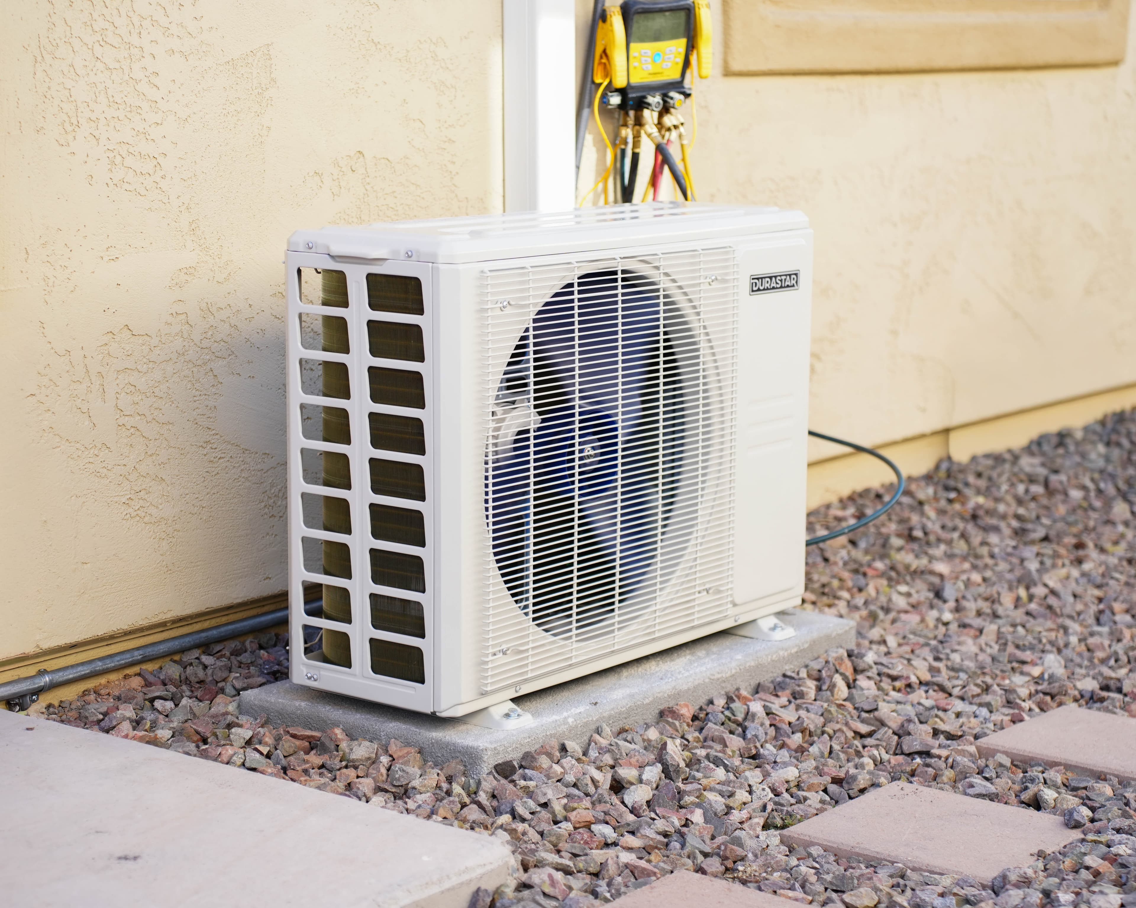 Williams Air & Heating technician working on an outdoor HVAC unit in Goodyear